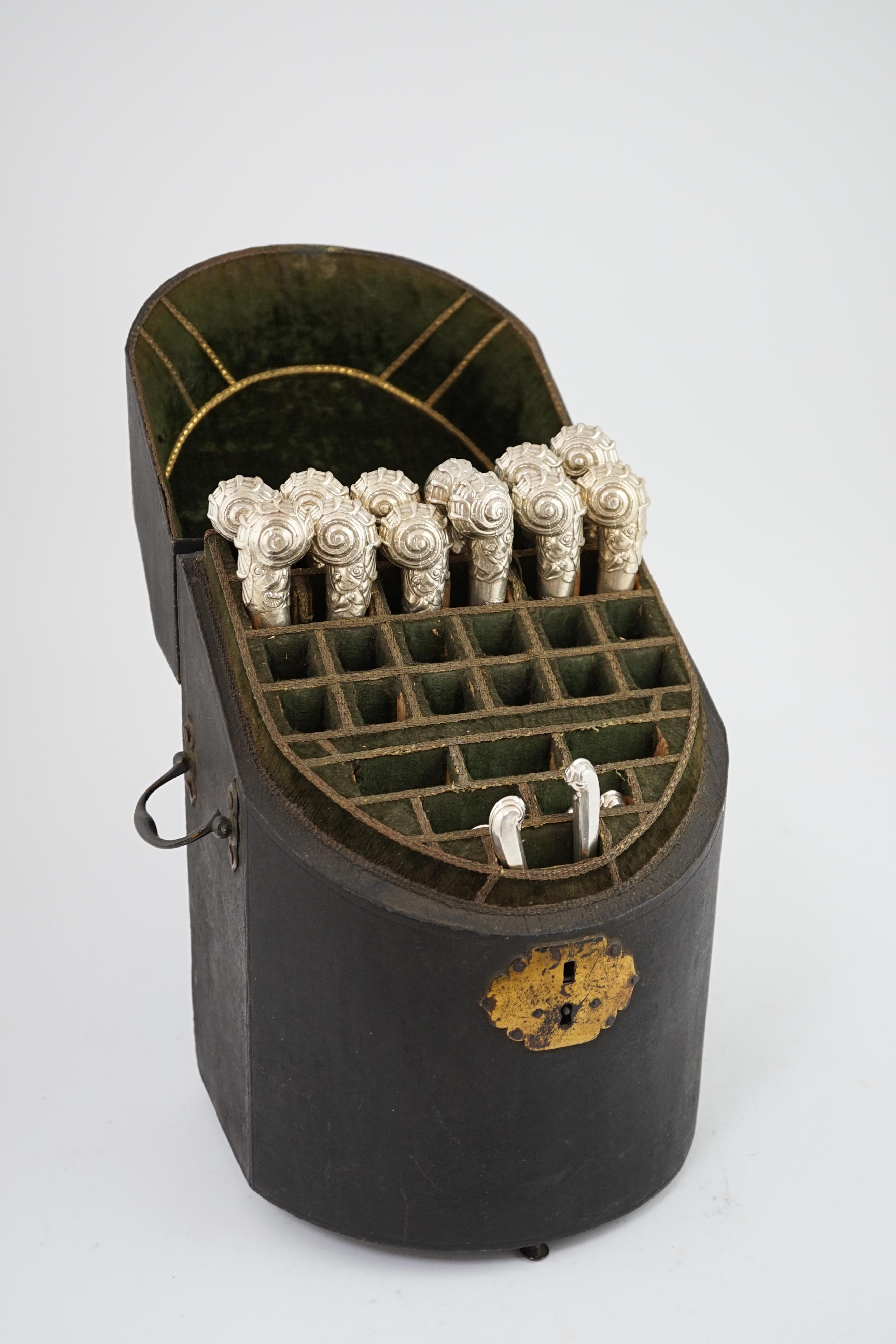 A George III fish skin covered knife box, housing a set of twelve George IV silver handled table knives